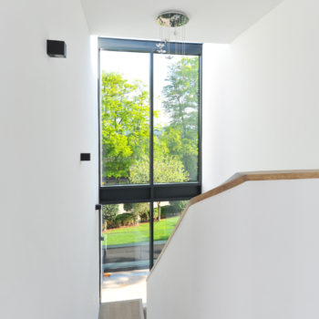 Double height windows accentuate the staircase