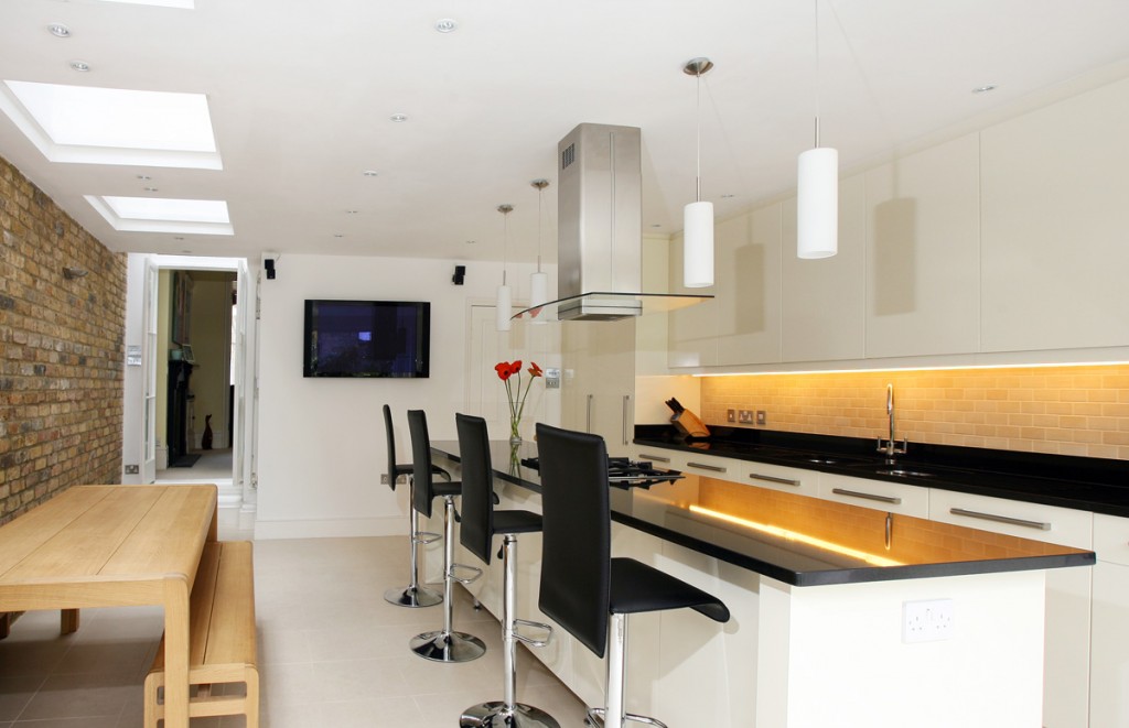 Kitchen with breakfast bar and dining area