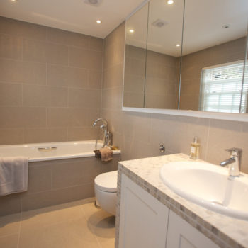 Bathroom with warm neutral tiles