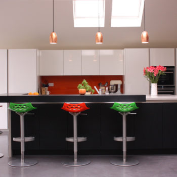 Black & white kitchen cabinets create a striking contrast